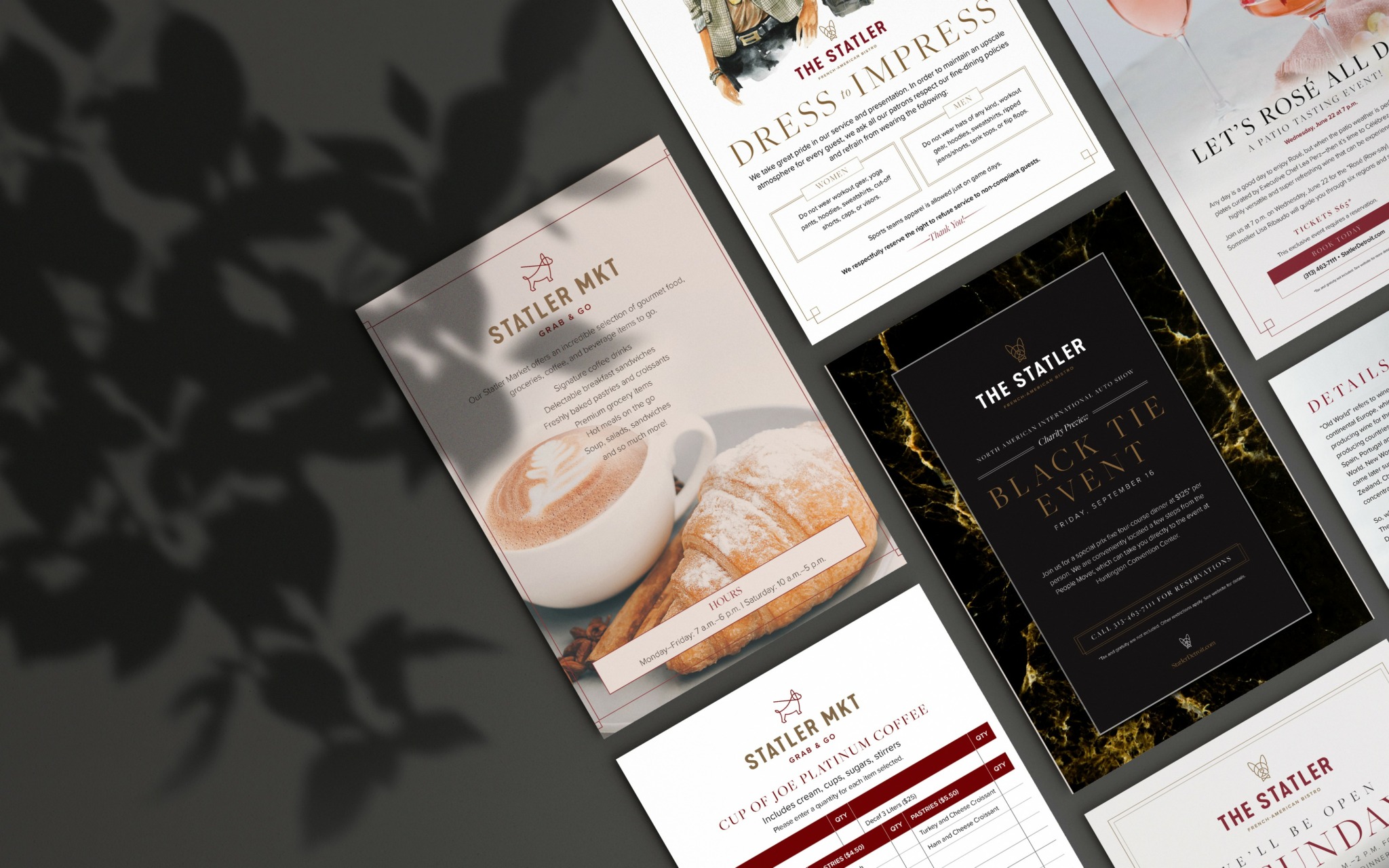 Collection of printed flyers or brochures with text and images, partially shadowed by plant leaves on the left side.