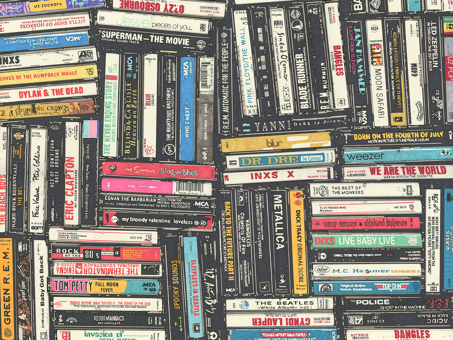 Bookshelves filled with various books arranged horizontally and vertically, with some titles visible on the spines.
