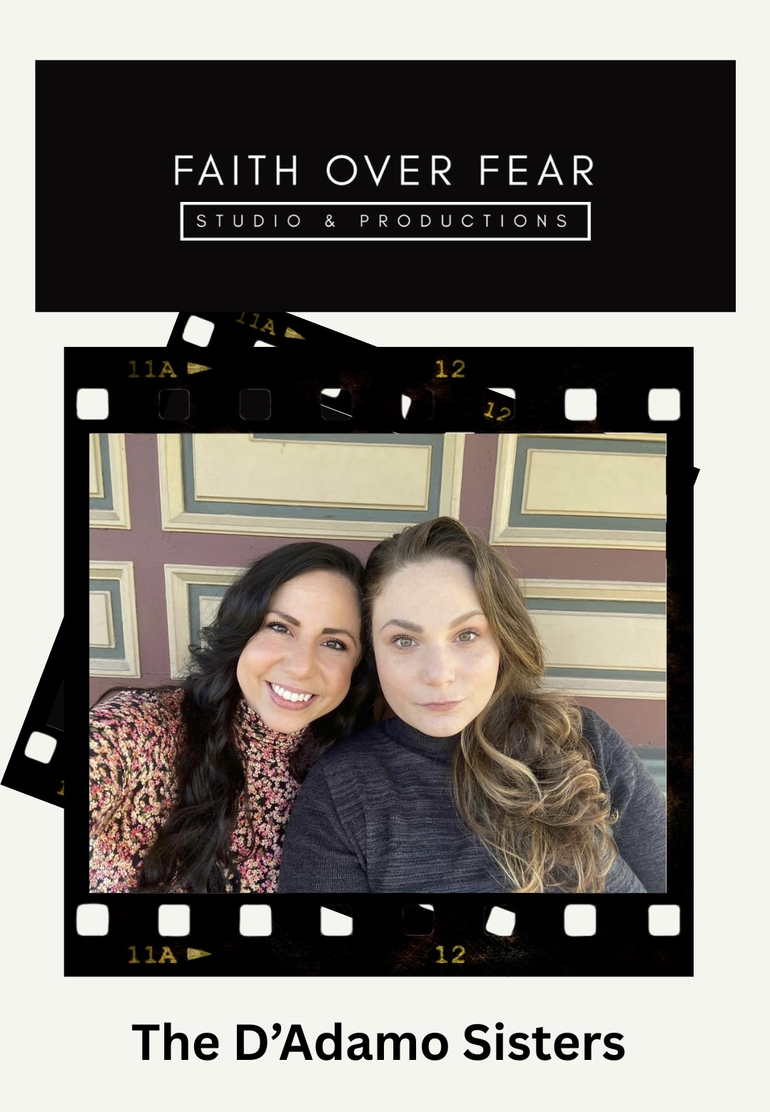 Two women smiling, posing for a photo in front of a patterned wall, with film strip border above and below.