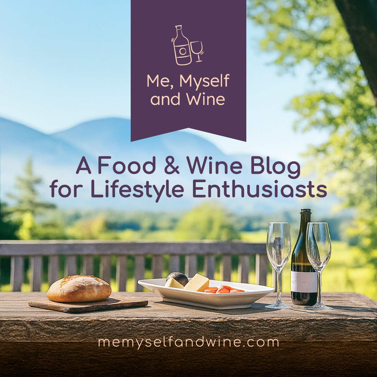 Outdoor table with bread, cheese, wine, and glasses, with a scenic mountain view in the background.