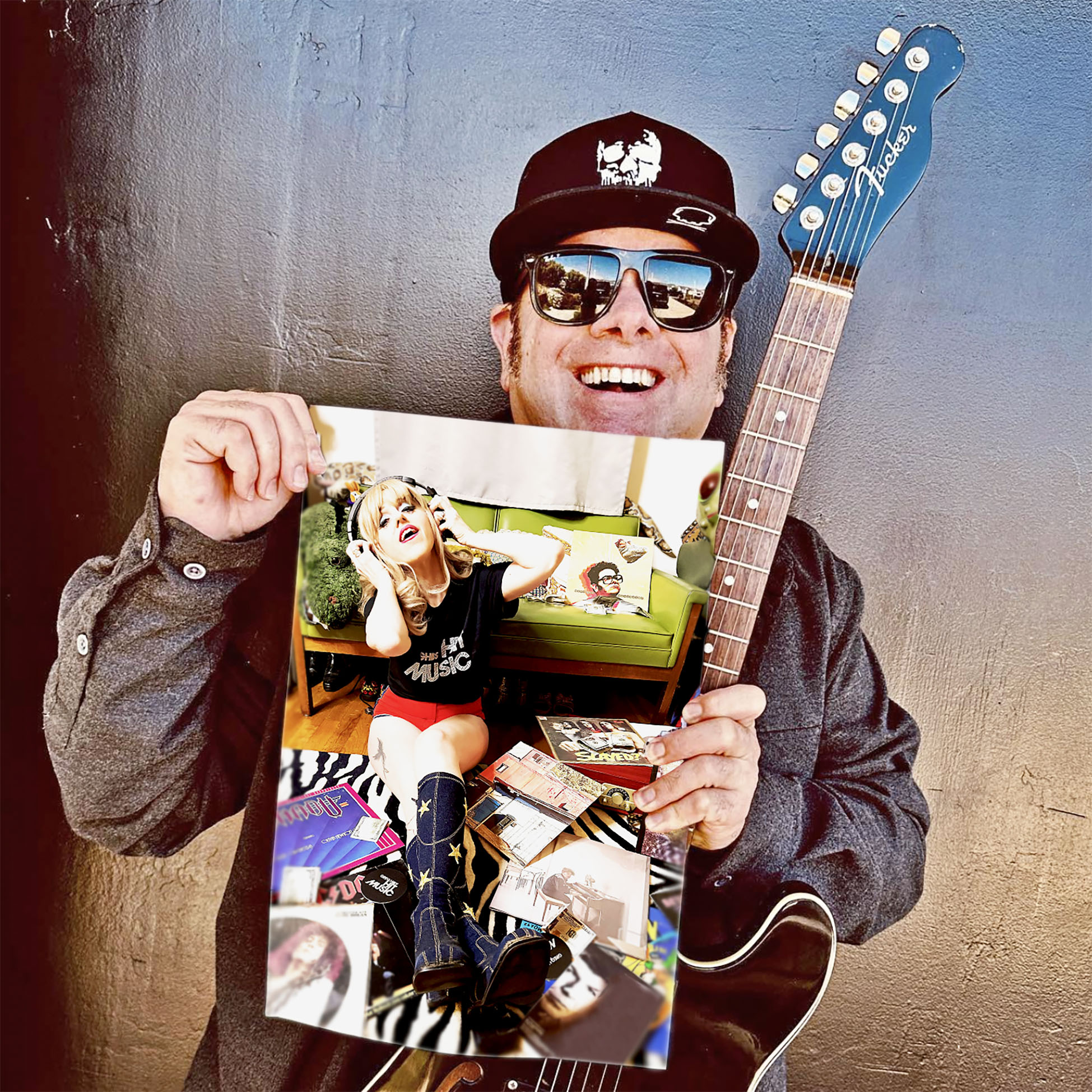 Person wearing sunglasses and a cap holding a guitar and a collage photo, smiling.