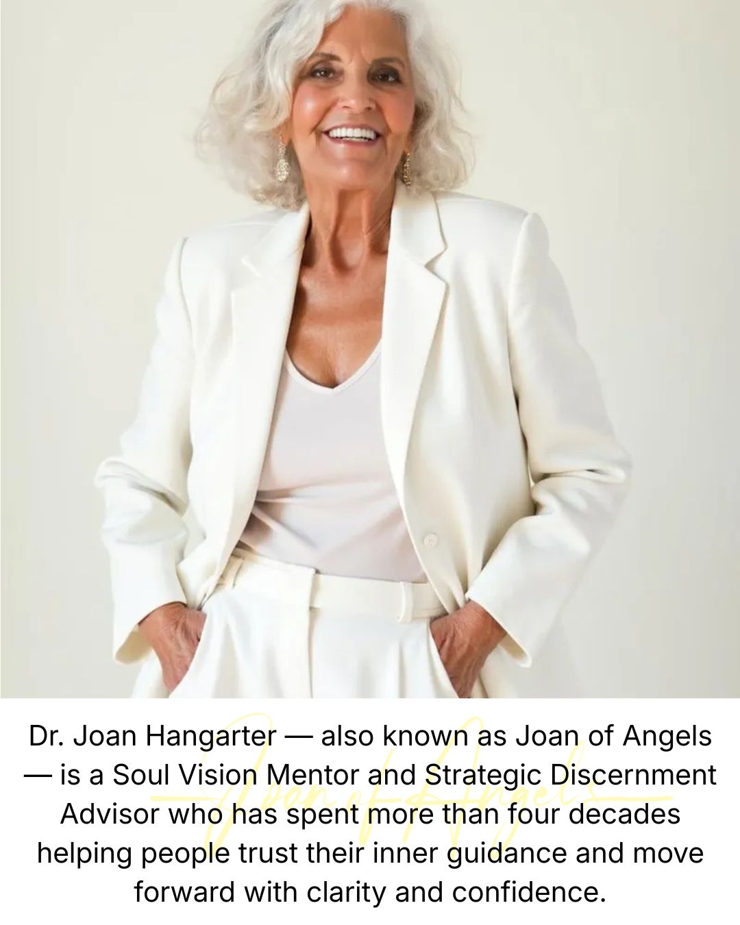 Smiling elderly woman with white hair in a white blazer and top, hands in pockets, standing against a plain background.