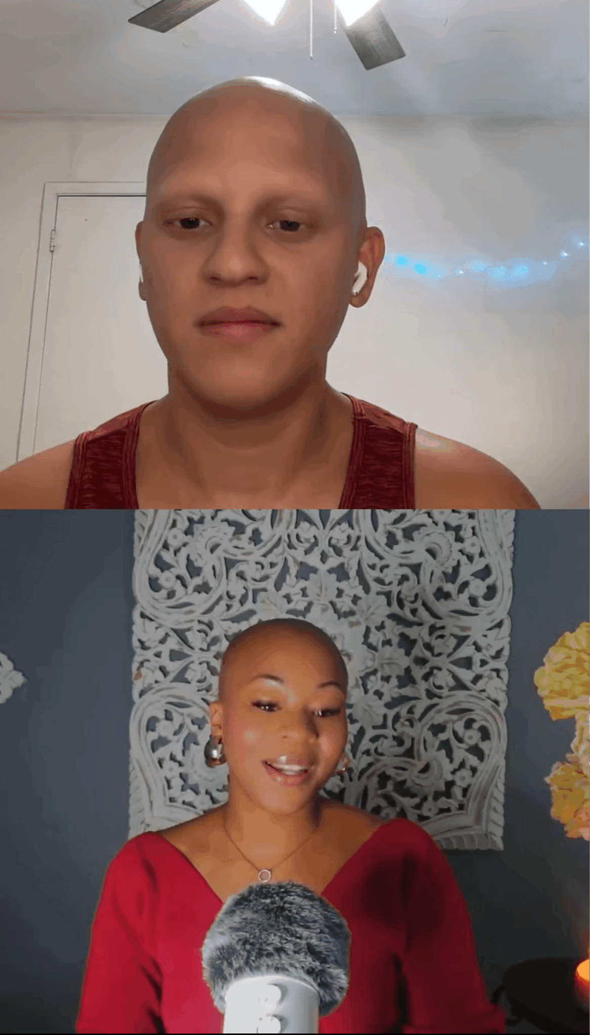 Two people, one bald and one with short hair, smiling, indoors with decorative background and microphone.