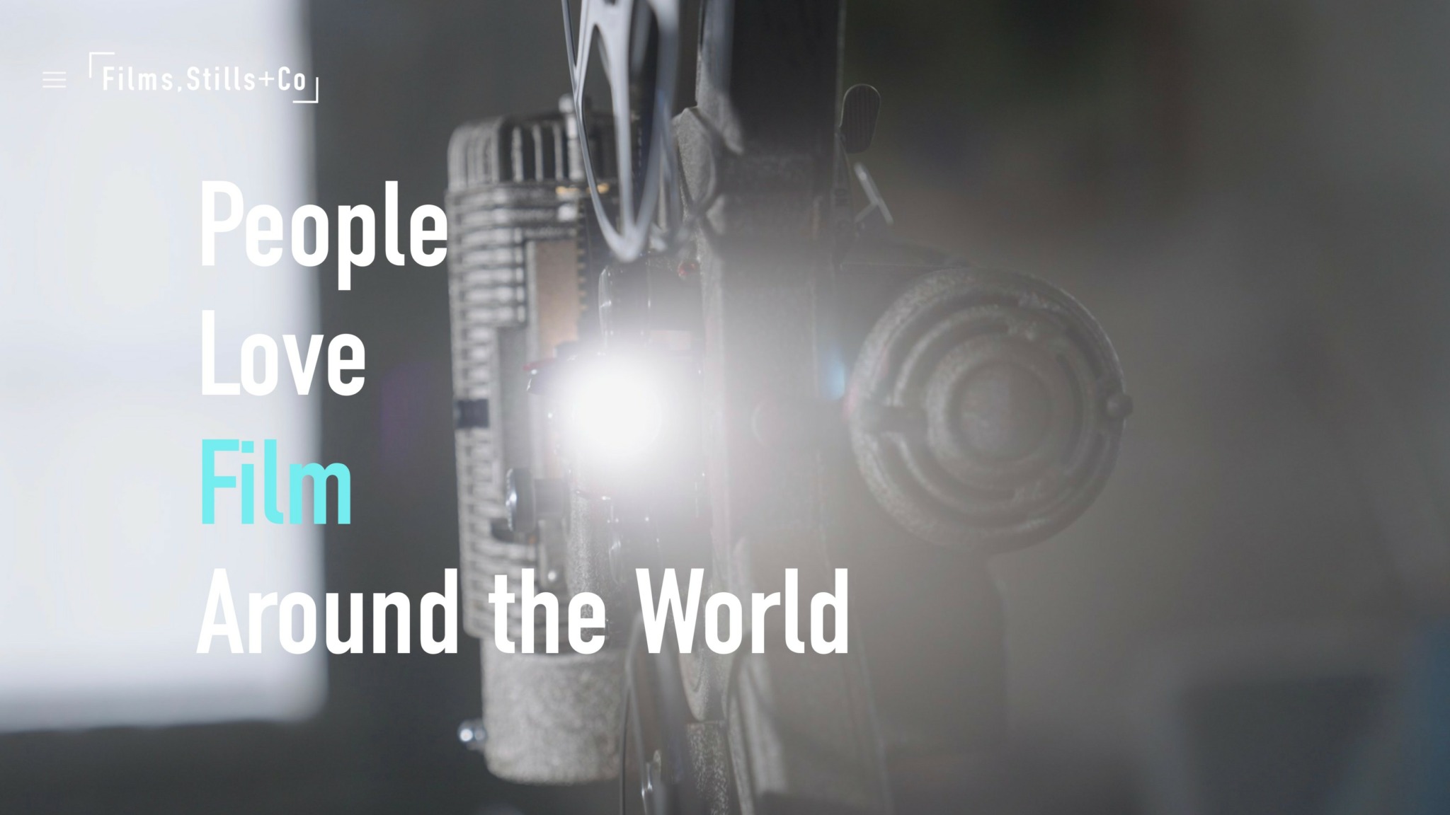 Close-up of a film camera with text overlay about people loving film worldwide.