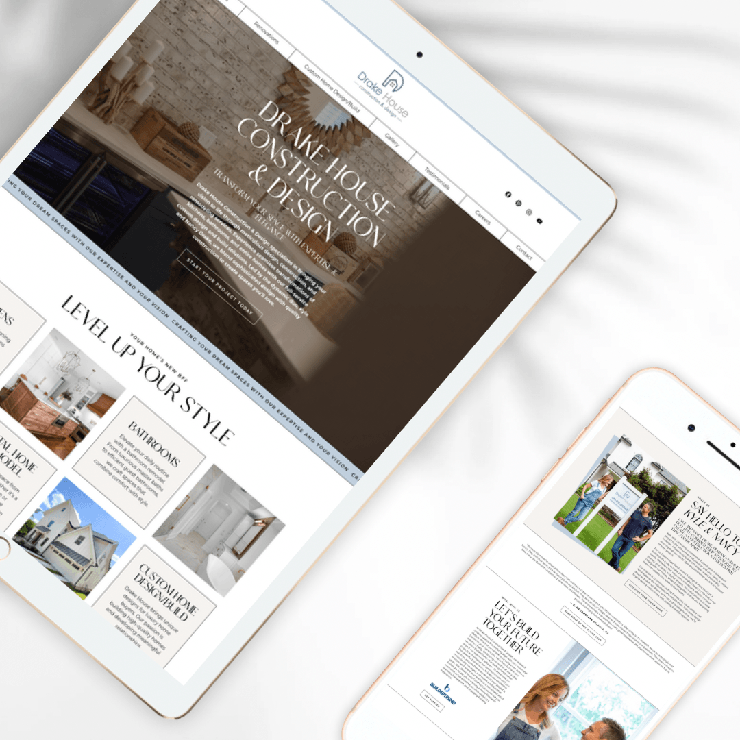Two tablets displaying interior design websites on a white surface.