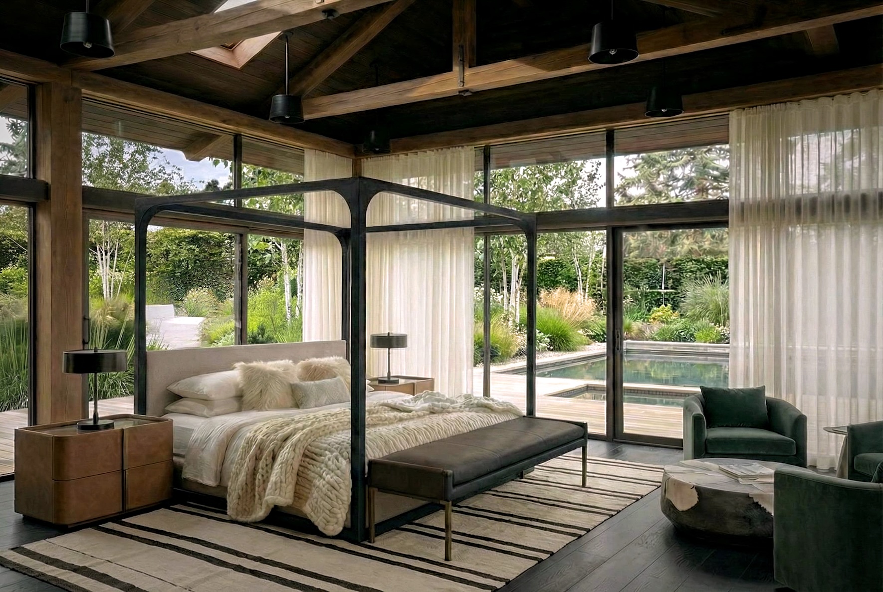 Bedroom with large windows, canopy bed, armchair, and view of greenery outside.