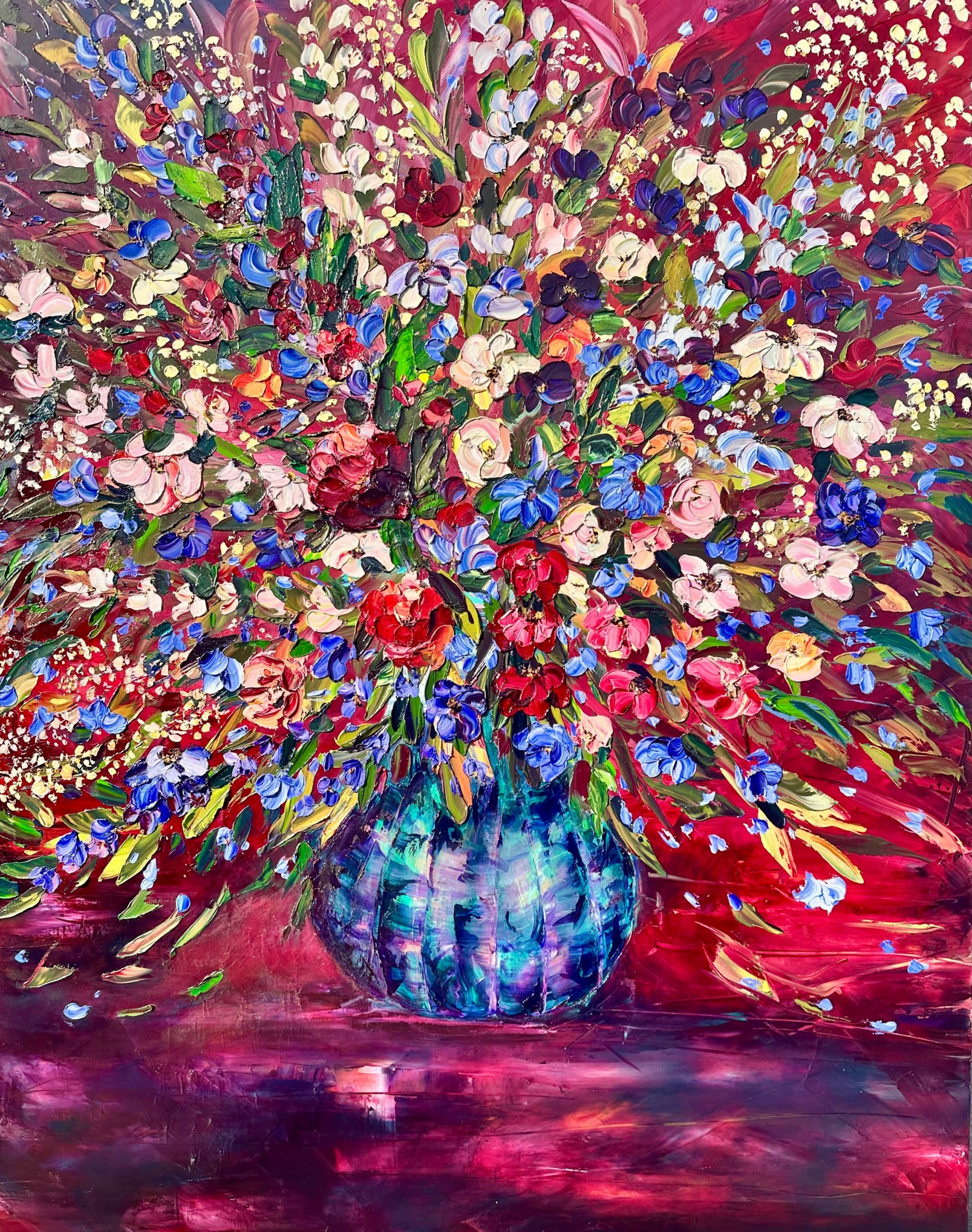 Colorful abstract painting of a flower bouquet in a blue vase with vibrant brushstrokes.