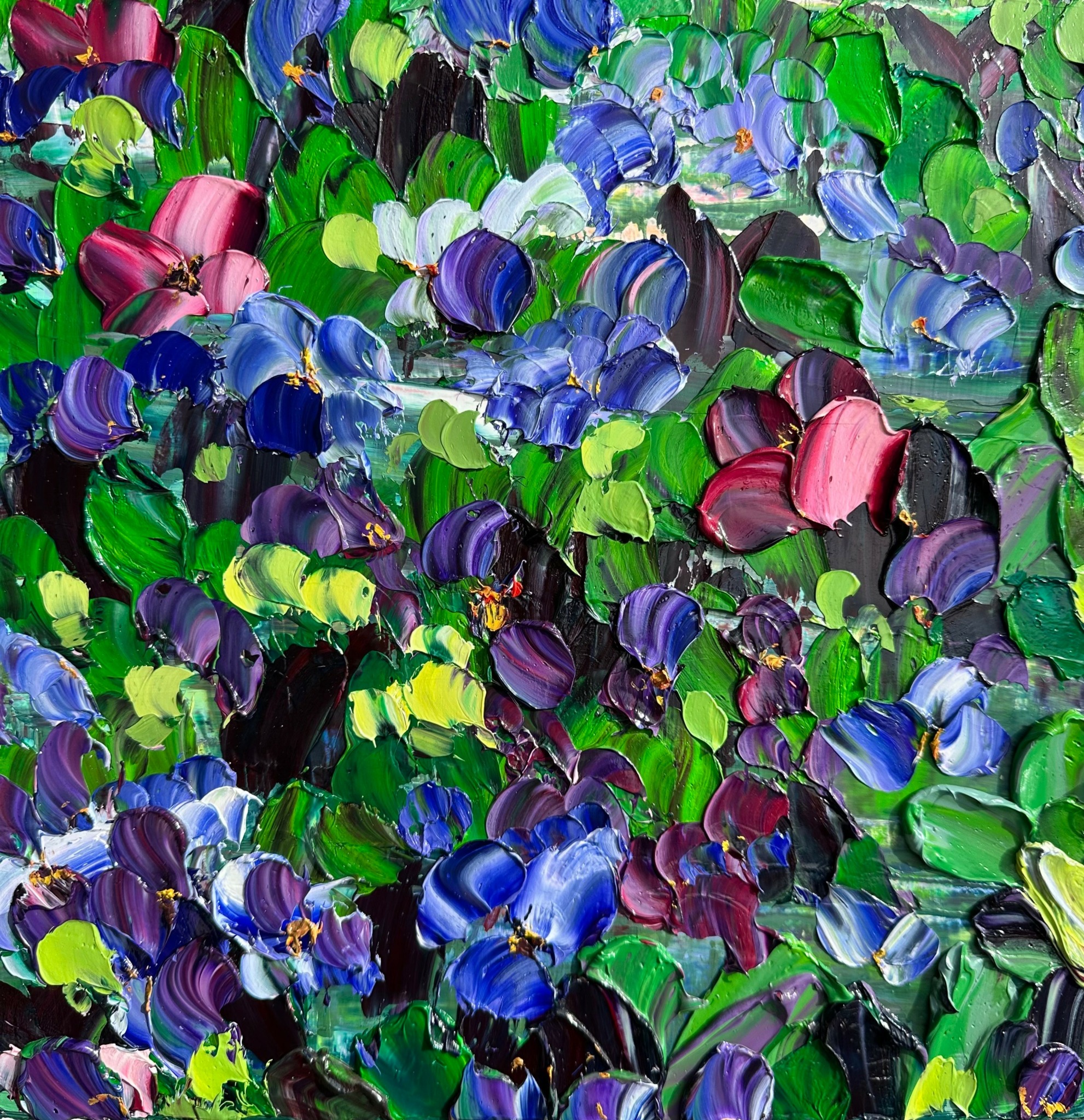 Abstract painting with thick, colorful brushstrokes in green, blue, purple, and pink hues.