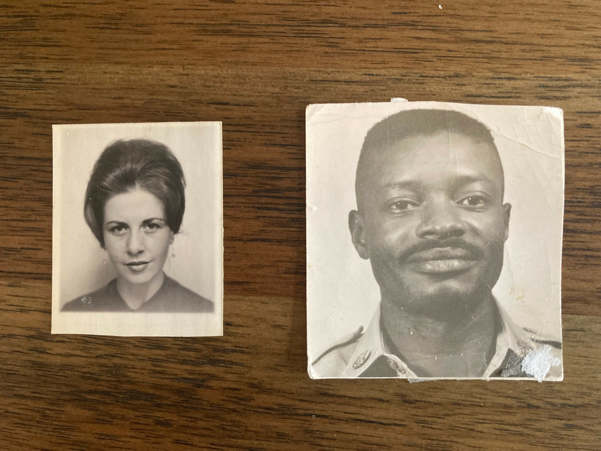Two black and white photographs of people on a wooden surface, one of a woman and one of a man.