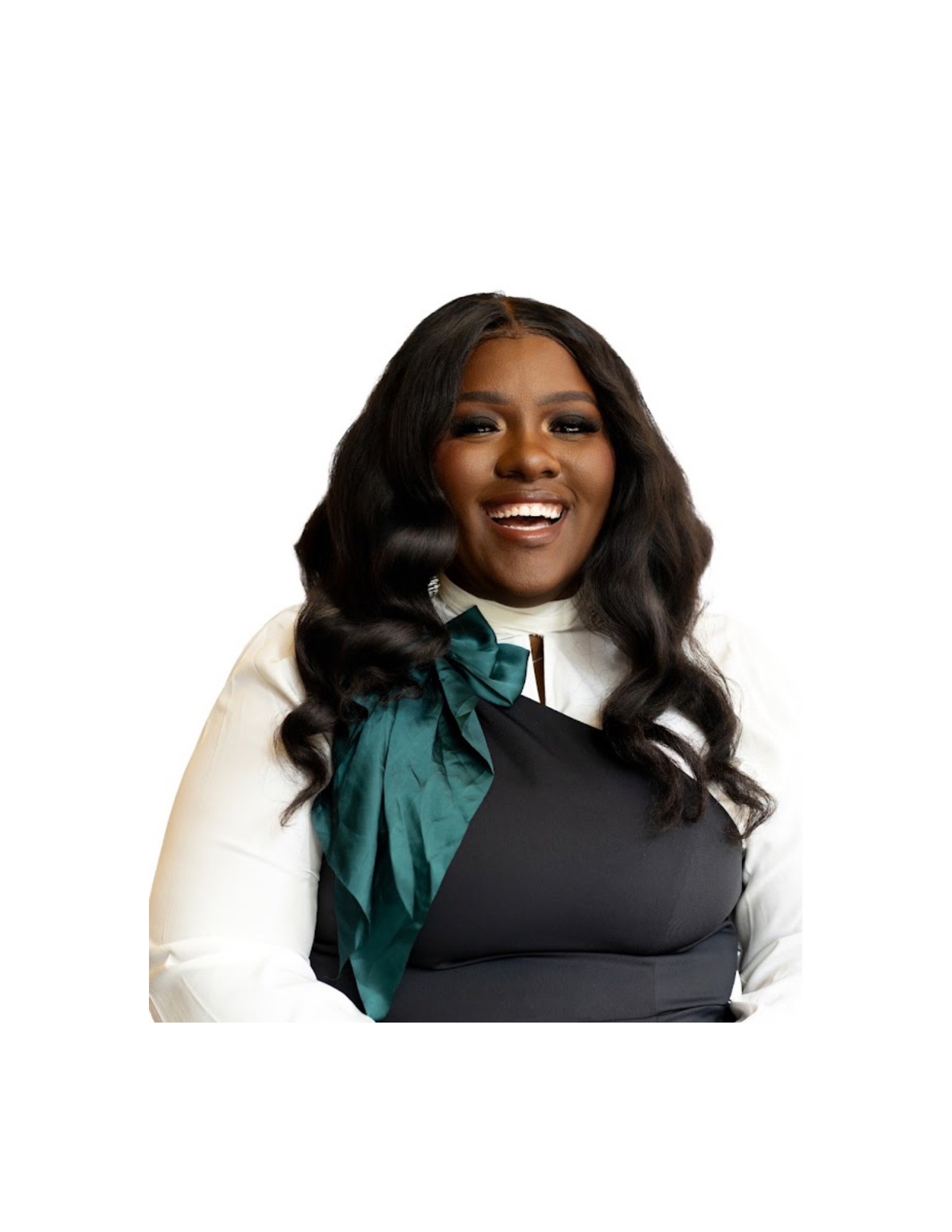 Smiling woman with long wavy hair wearing a white blouse and a dark top with a teal bow.