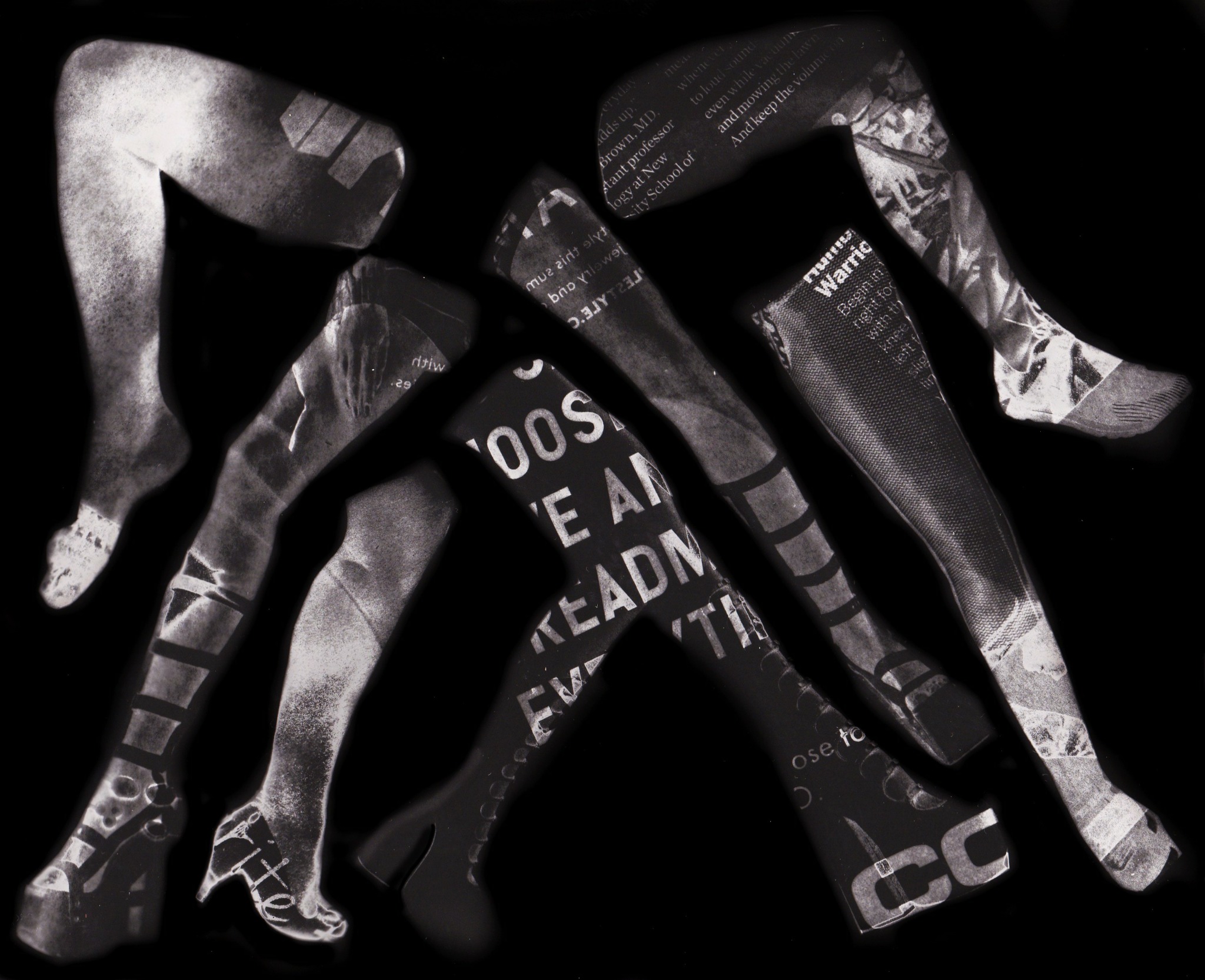 Silhouettes of four people walking, with text and images projected onto their bodies, against a dark background.