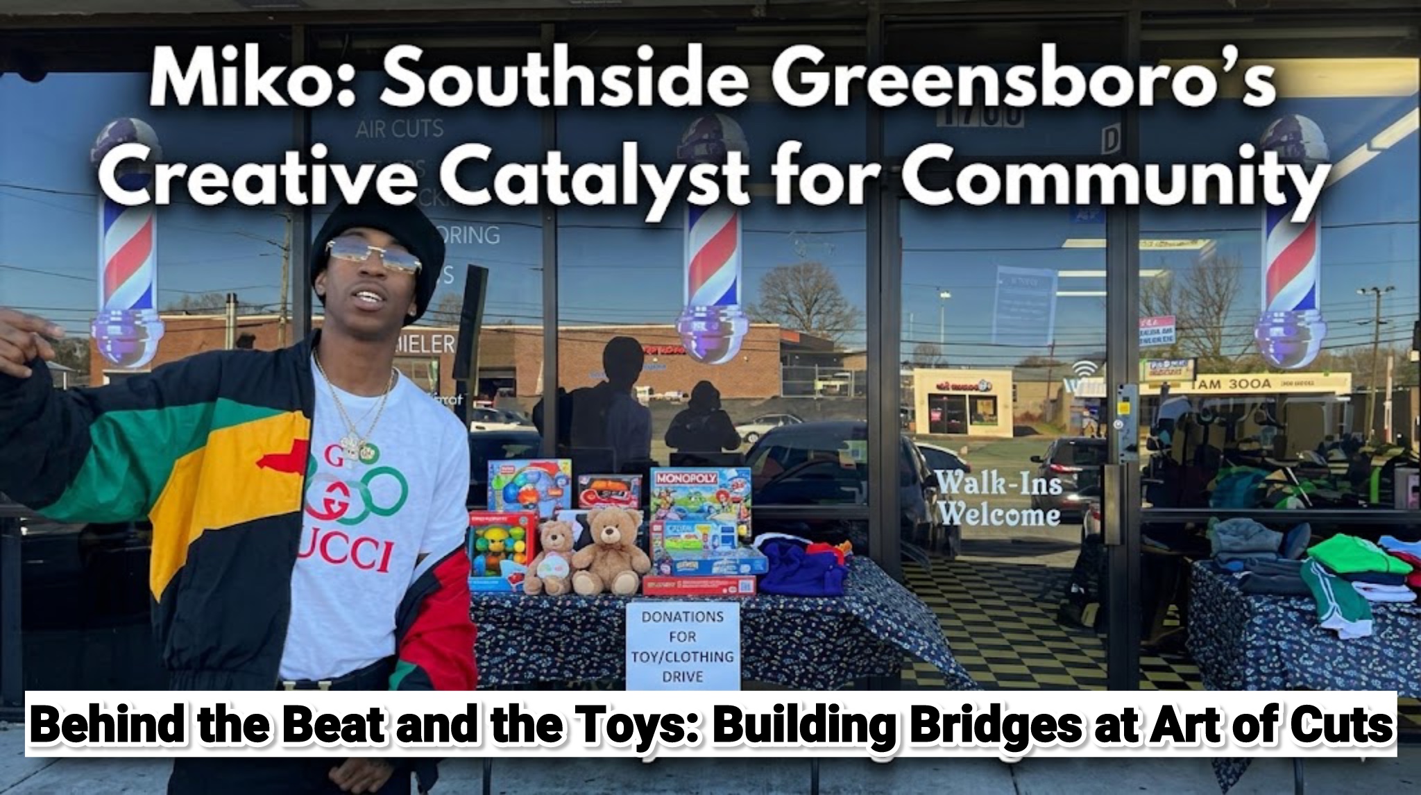 Person standing outside store with toys and community event banners in background.