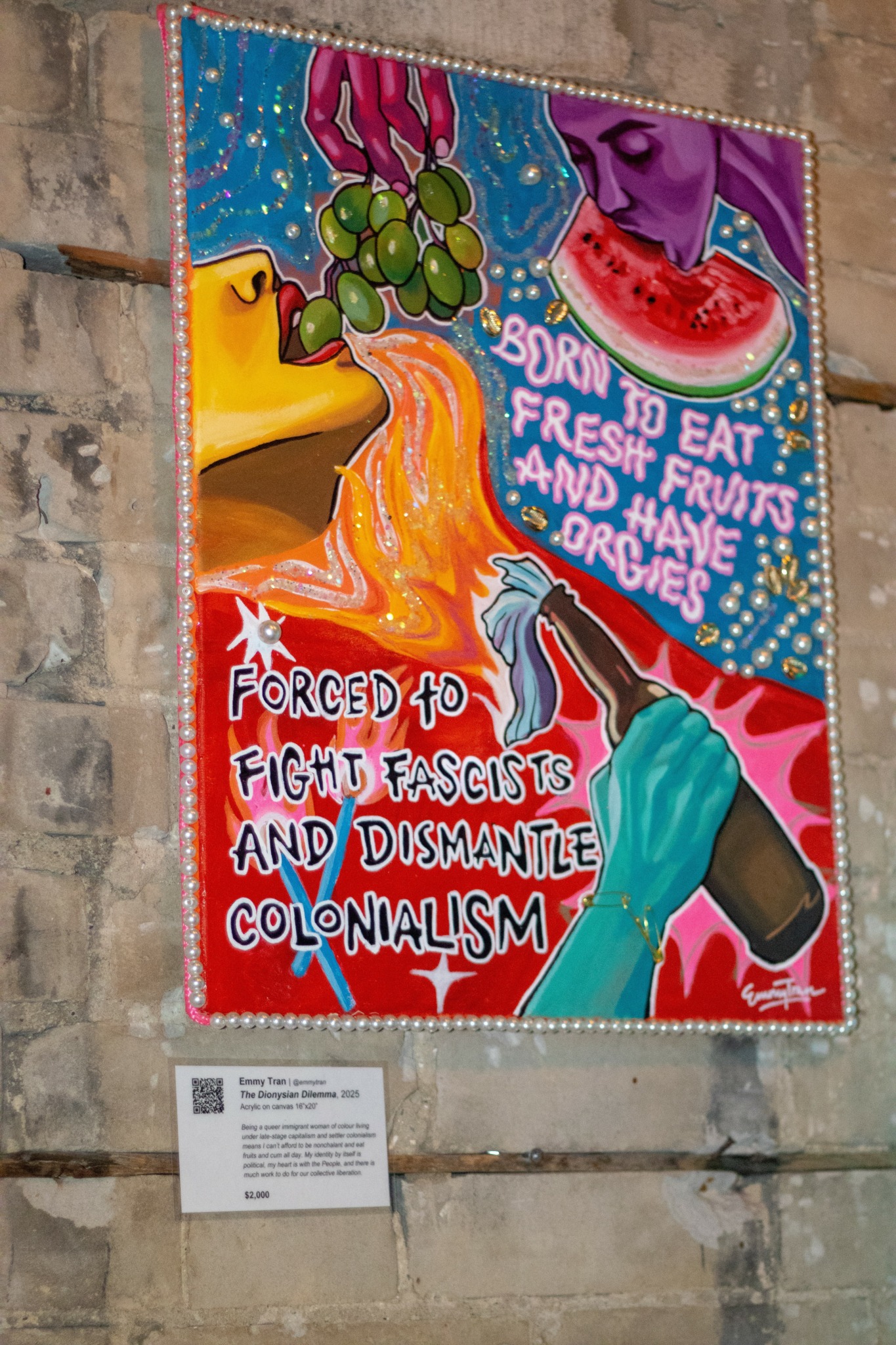 Colorful mural with a woman eating watermelon, a hand holding a bottle, and text about fighting fascism and colonialism.