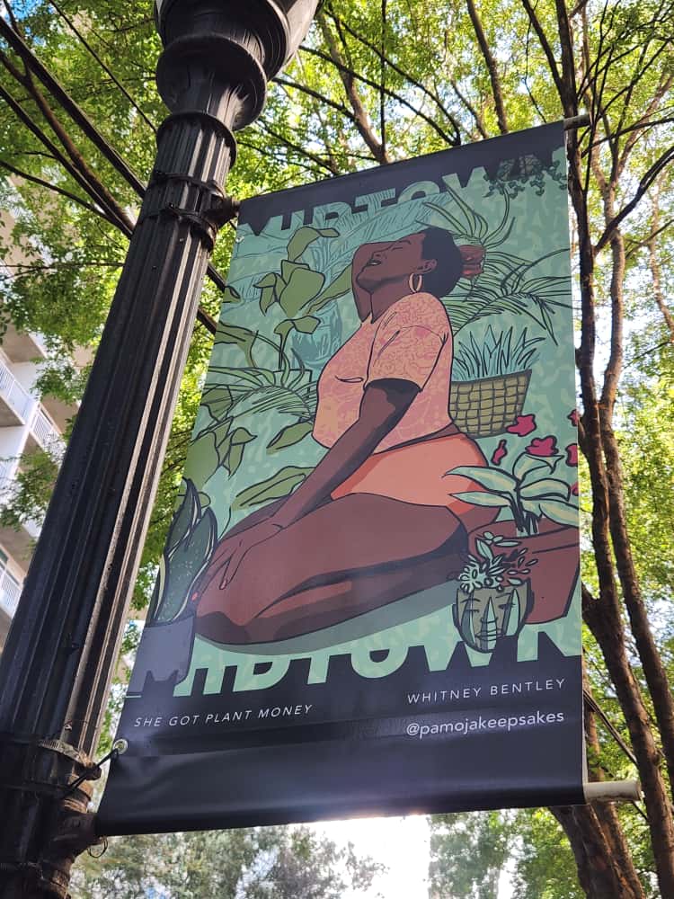 Illustration of a woman sitting among plants, with a basket and potted plants around her, on a banner outdoors.