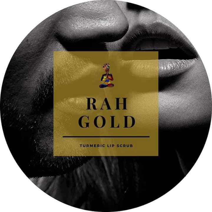 Close-up of lips with a gold label reading 'RAH GOLD' and 'TURMERIC LIP SCRUB'.