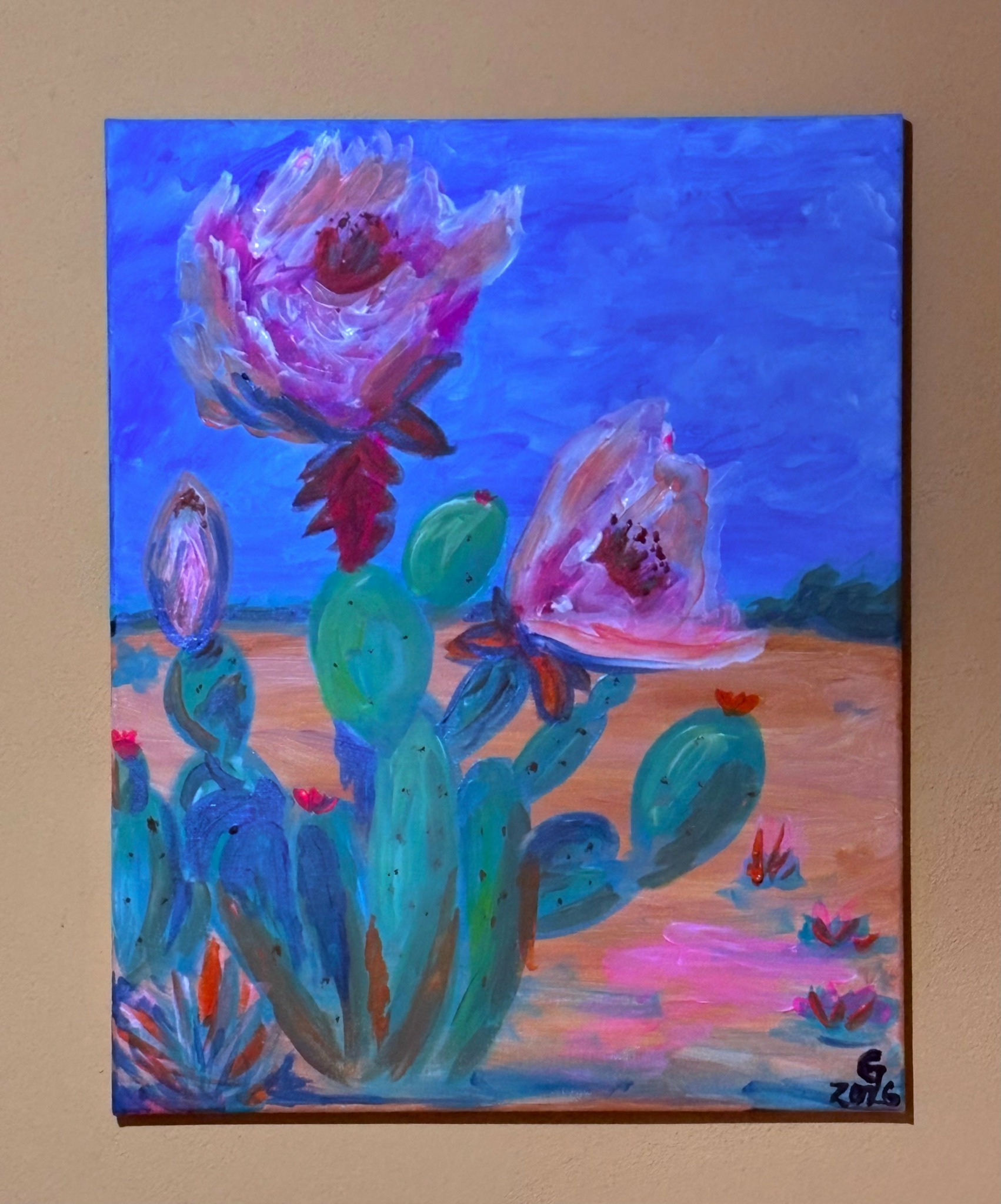 Painting of cactus plants with pink flowers against a blue sky and desert landscape.