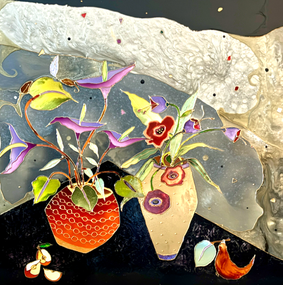 Two colorful vases with flowers on a dark surface, with a textured background and scattered small objects.